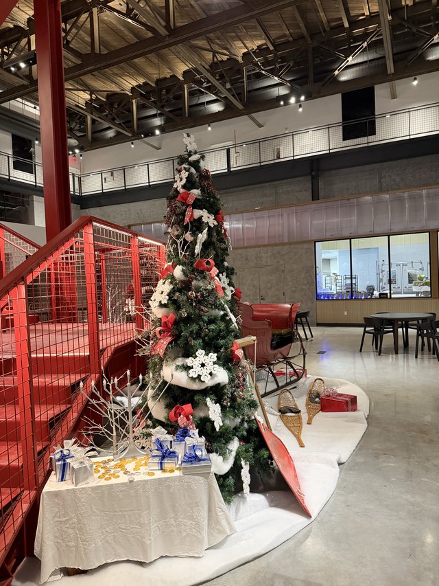 Festive Christmas Tree in Modern Industrial Office Lobby