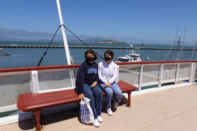 Two Friends Enjoying Waterfront Views Together
