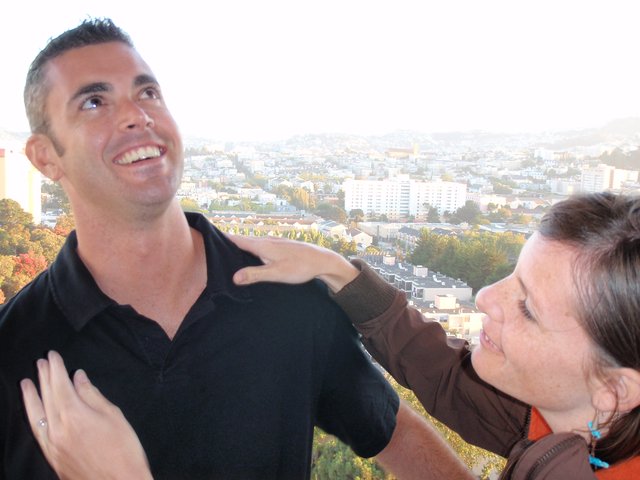 Playful Couple Enjoying San Francisco Hilltop View