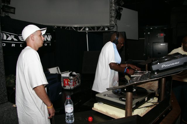 DJ S and friend behind the music table