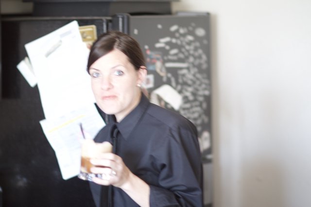 Woman Reviews Bills with Concerned Expression in Kitchen