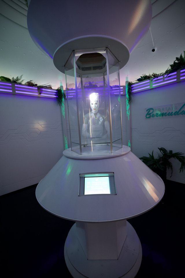 Retro-Futuristic Robot Display in Glass Teleportation Chamber