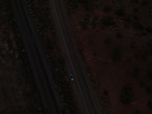 Aerial View of a Car on the Open Road