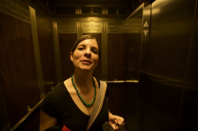 Woman in Elevator During Art Walk Night