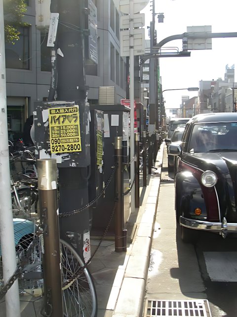 Parked Black Car on an Urban Street