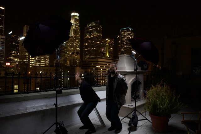 Two Men Capturing the Metropolis at Night
