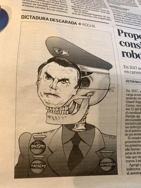 Cartoon of Jair Bolsonaro in Military Uniform on Newspaper Page