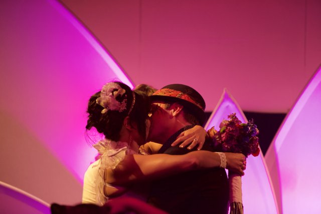 A Passionate Kiss Underneath the Purple Light