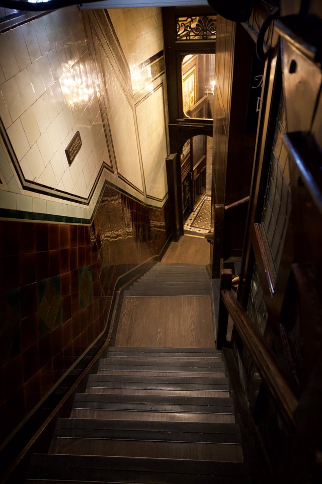 Elegant Victorian-Era Stairwell with Ornate Tile Work