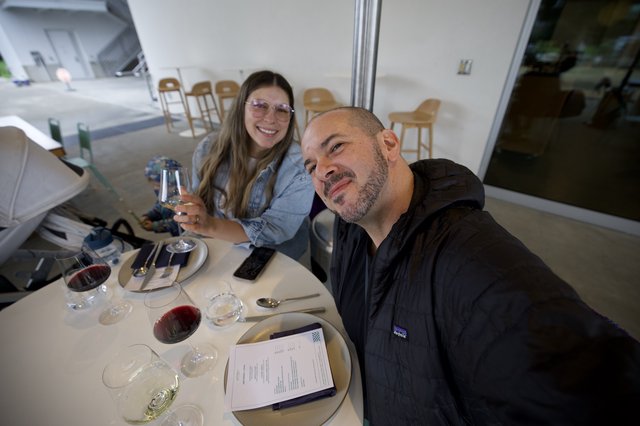 Couple Enjoying Wine Tasting at Modern Restaurant