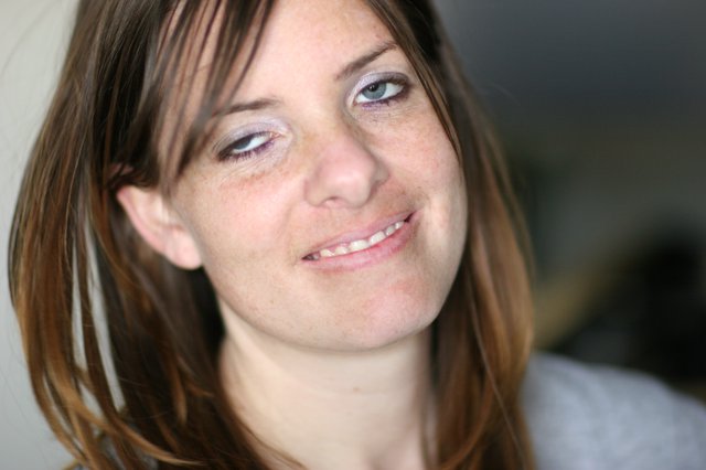 Candid Portrait of Smiling Young Woman Indoors