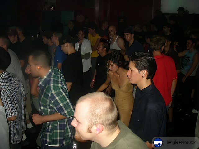 Man in the Middle Caption: The center of attention at the lively night club party.