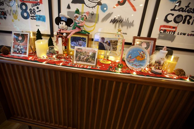 Festive Christmas Display with Disney Decorations and Family Photos