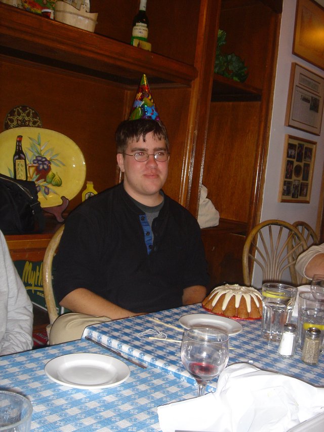 Birthday Celebration with Party Hat at Restaurant