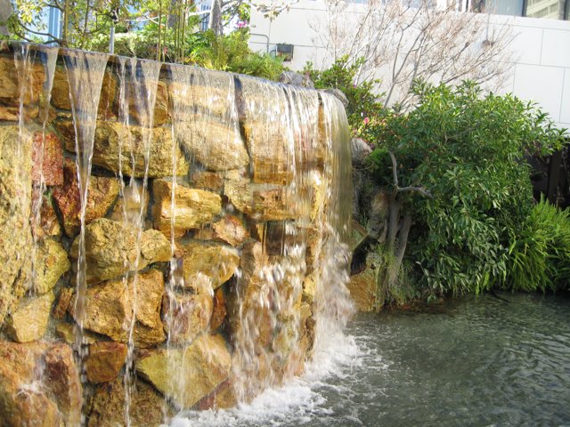 Serene Waterfall in a Lush Garden