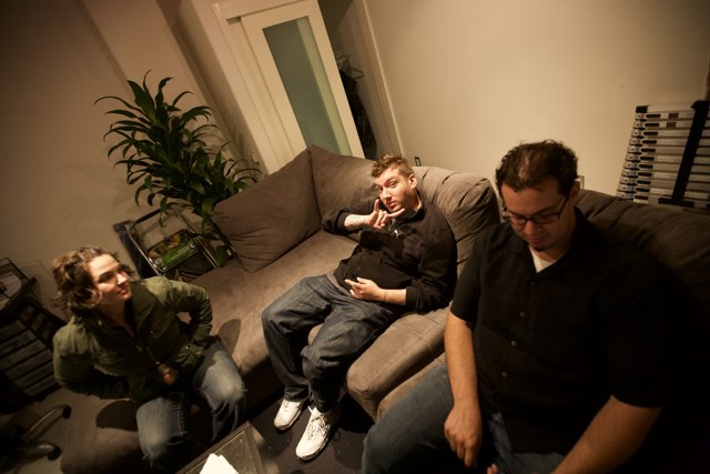 Three Men Lounging on a Comfy Couch