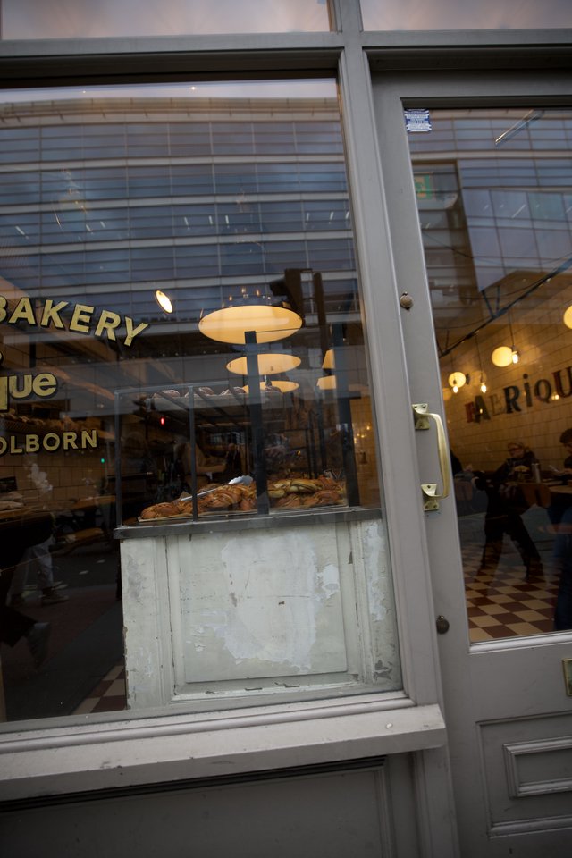 Holborn Bakery Storefront Window Display at Dusk