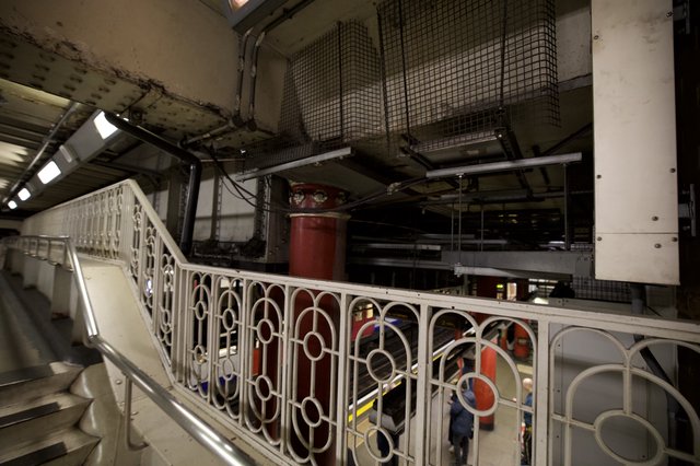 Industrial Underground Station Platform with Ornate Victorian Railings