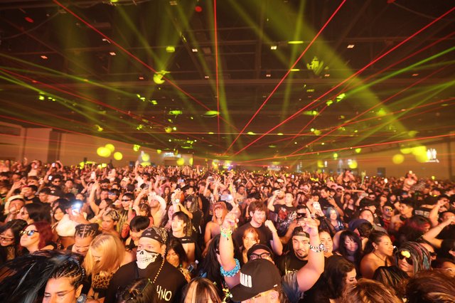 Massive Crowd Erupts Under Laser Light Show