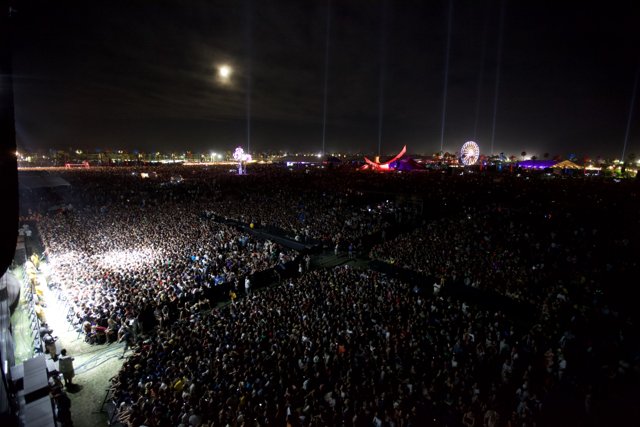 Epic Lighting: A Massive Crowd Rocks Out Under the Night Sky