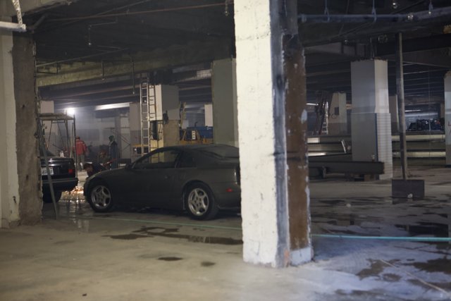 Parked Coupe in Empty Garage