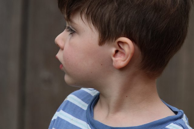 Young Boy in Blue Striped Shirt - Side Profile Portrait