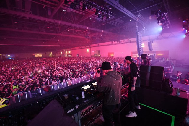 DJ Performs to Massive Indoor Festival Crowd