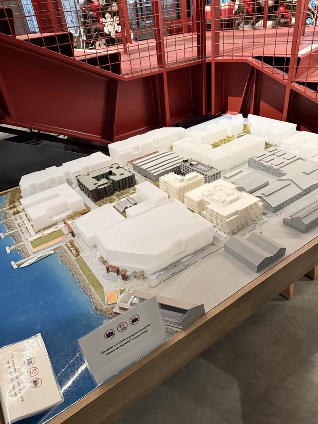 Architectural Model Display in Red Gallery Space