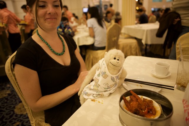 Stuffed Monkey Joins Dim Sum Dinner in Restaurant