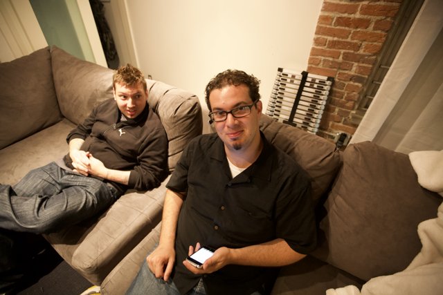 Two Men Relaxing on a Cozy Couch