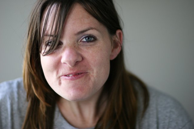 Candid Close-Up Portrait of a Young Woman Smiling