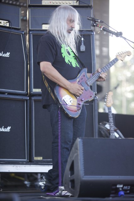 The White-Haired Guitarist Rocks the Stage