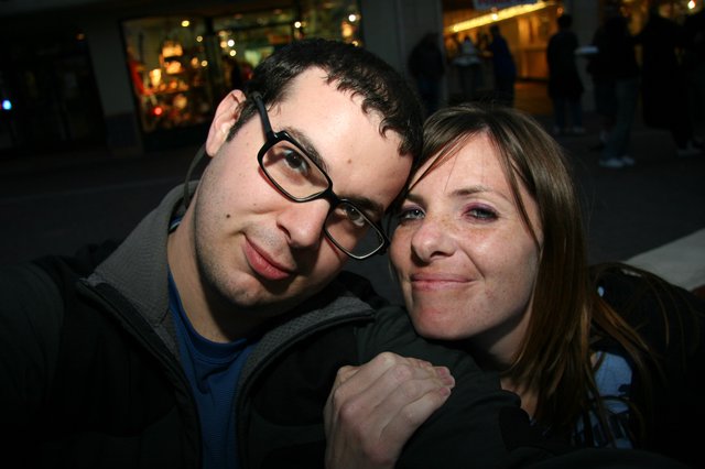 Couple Shares a Playful Moment on City Street