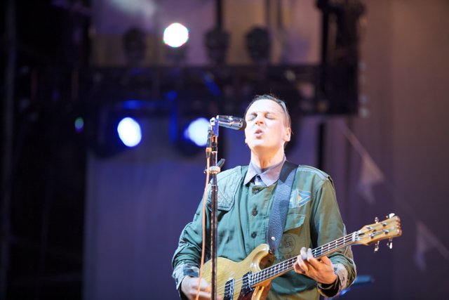 Win Butler Shines on Stage with His Guitar