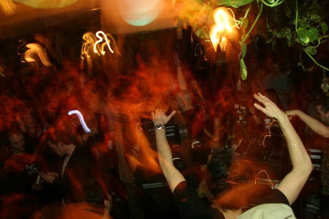 Party People in Club with Fiery Atmosphere