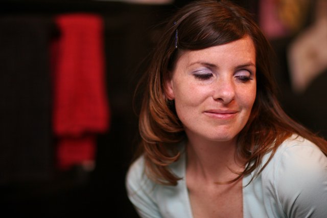 Contemplative Woman in Soft Indoor Light