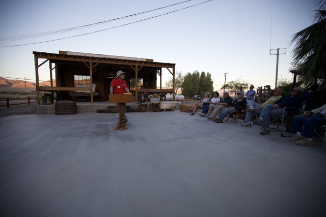 Ron English giving a speech in the desert