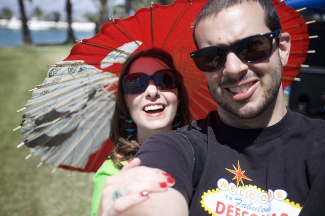 Couple Selfie at Coachella with Red Parasols