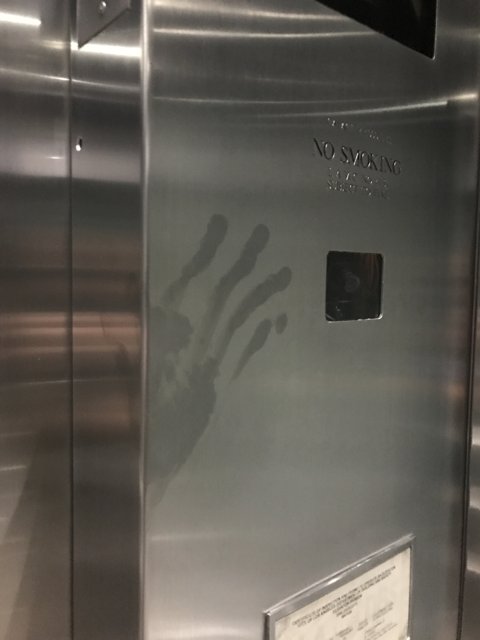 Elevator Handprint