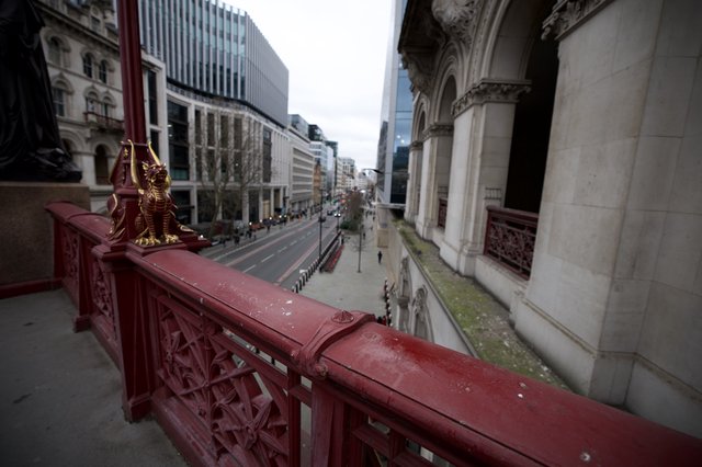 Ornate Red Bridge Overlooking London Street at Dusk
