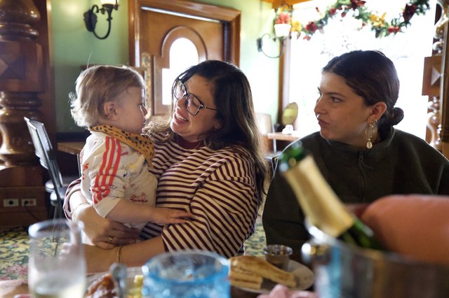 Three Generations Sharing a Joyful Holiday Meal