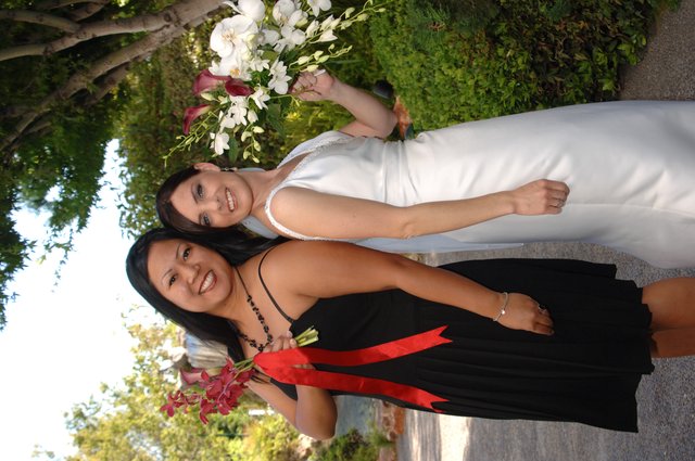 Bride and Bridesmaid Celebrate at Outdoor Wedding