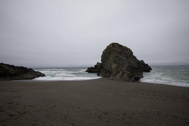 Moody Sea Stack on a Fog-Shrouded Northern California Beach