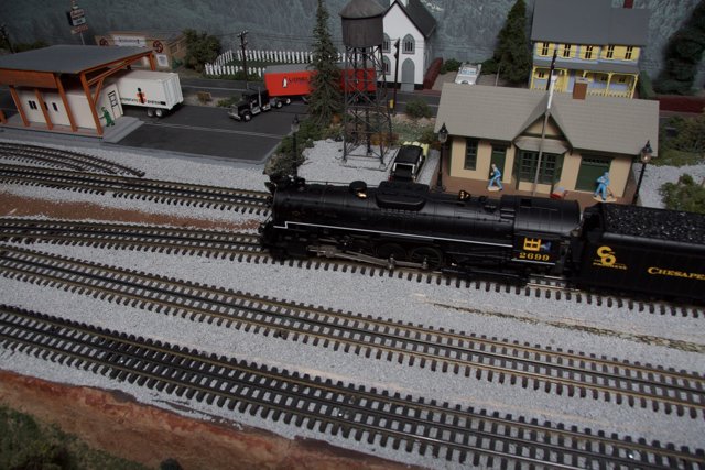 Model Train Passing Through a Quaint Town
