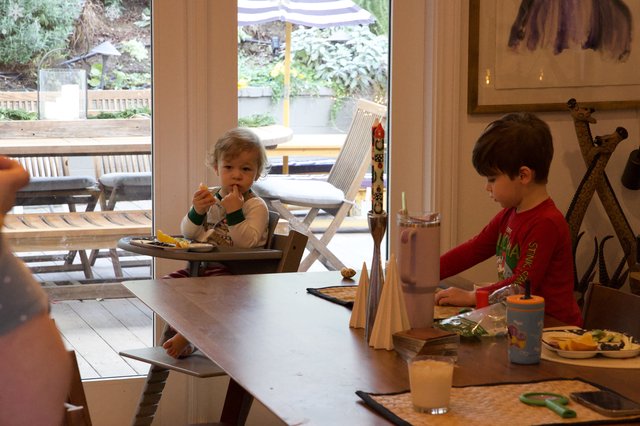 Children's Mealtime in Modern Kitchen During Christmas