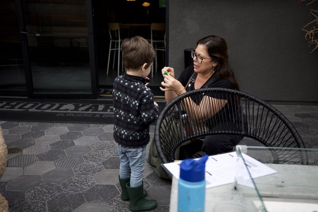 Mother and Child Moment at Urban Outdoor Café
