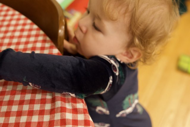 Toddler Making Phone Call at Christmas Gathering