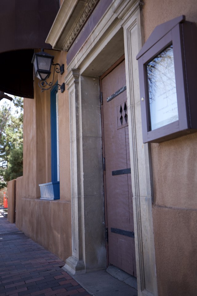 Historic Adobe Building Entrance with Ornate Details