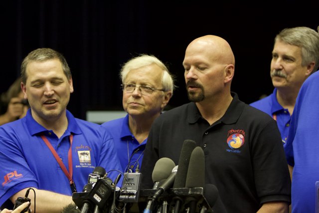 Press Conference with Blue-Shirted Men