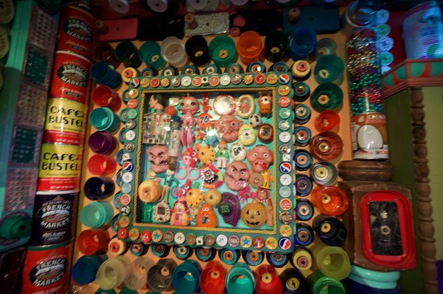 Eclectic Folk Art Collage with Bottle Caps and Vintage Toys